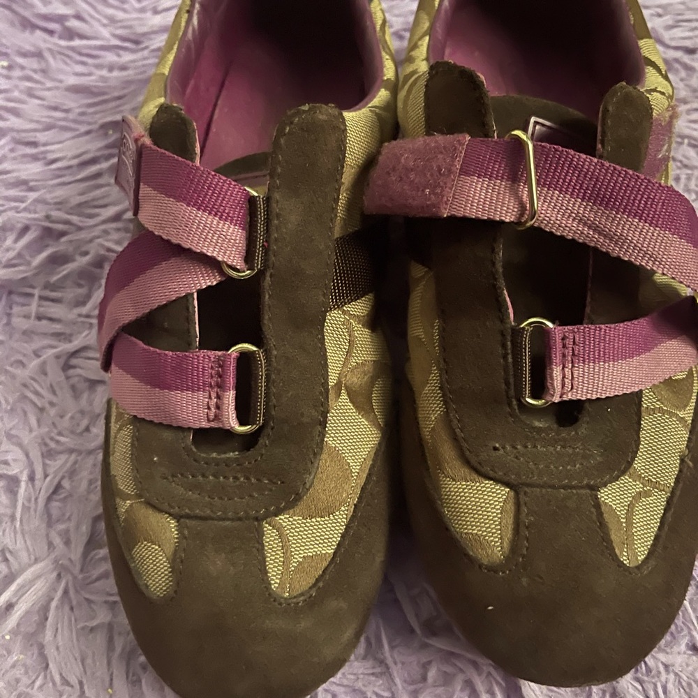 Women… Brown and purple coach… sneakers.. Made by Coach..